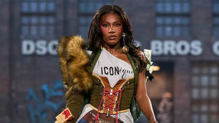 Fashion model on runway wearing Dsquared2 outfit with fur detail, corset, and graphic top