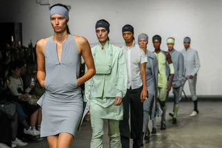Fashion models walking runway in minimalist pastel and grey athletic-inspired outfits with headbands at fashion show