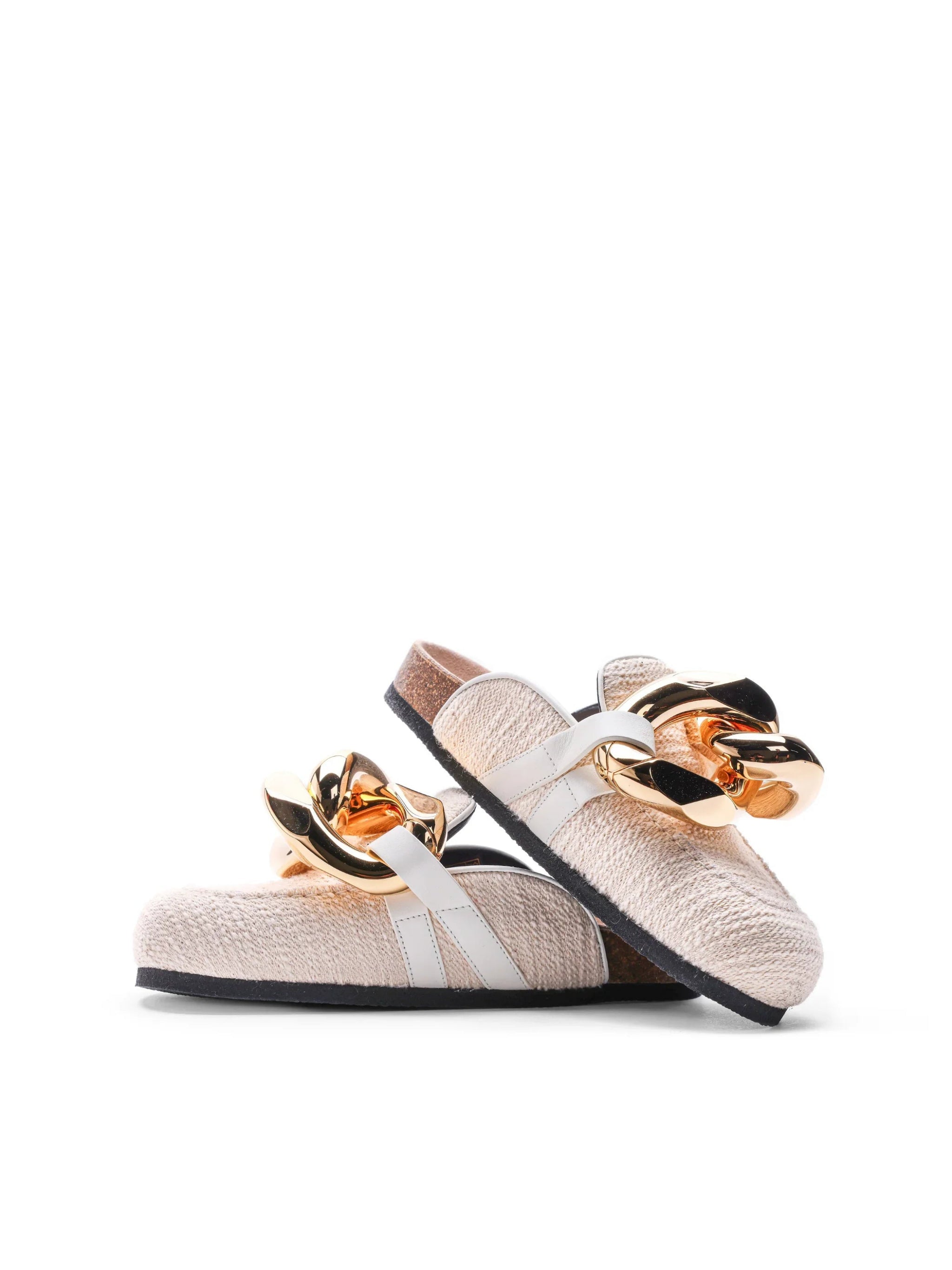 Beige textured slip-on sandals with white straps and large shiny gold chain decor