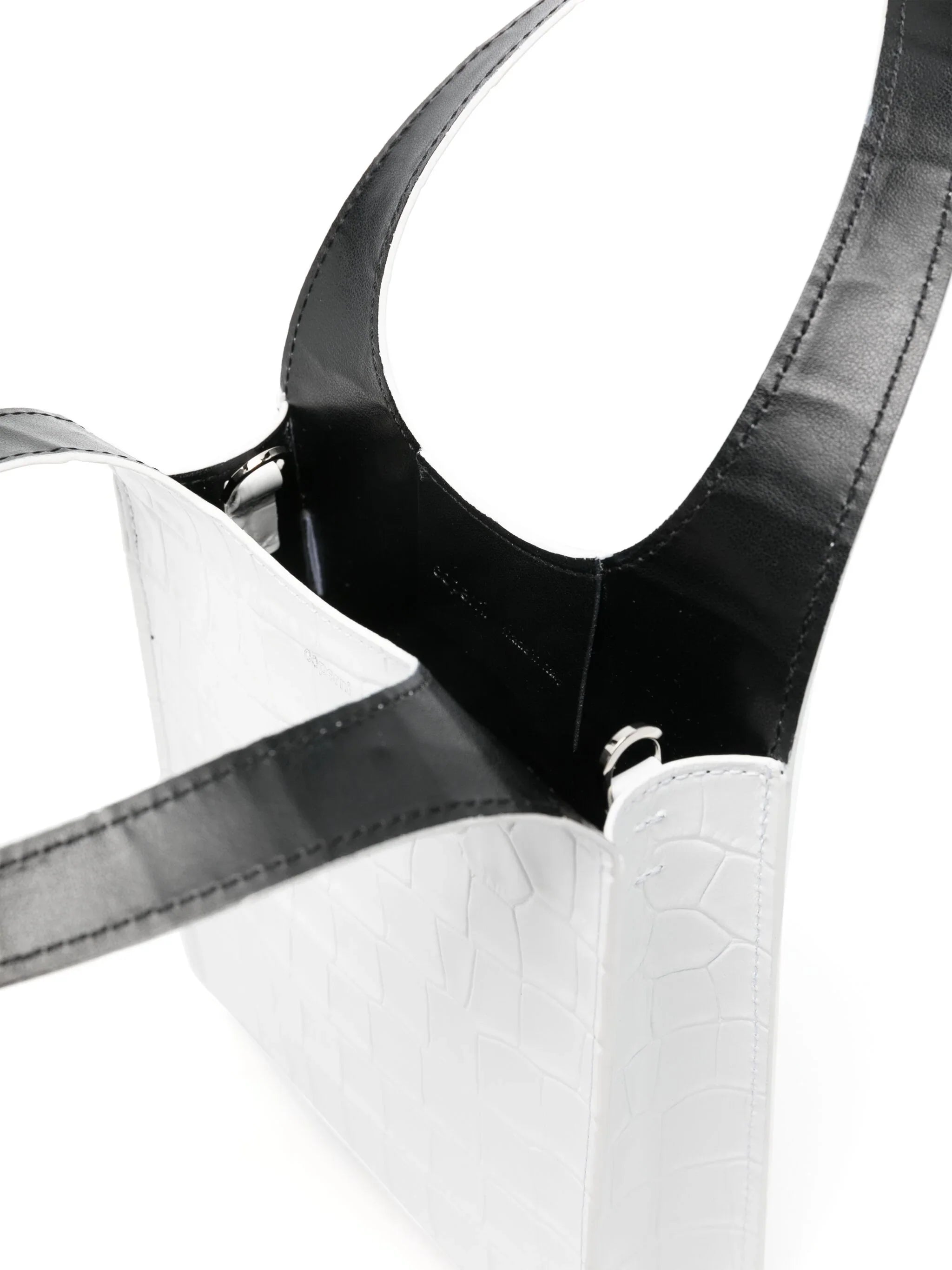 White crocodile texture handbag with black leather handles and open top view