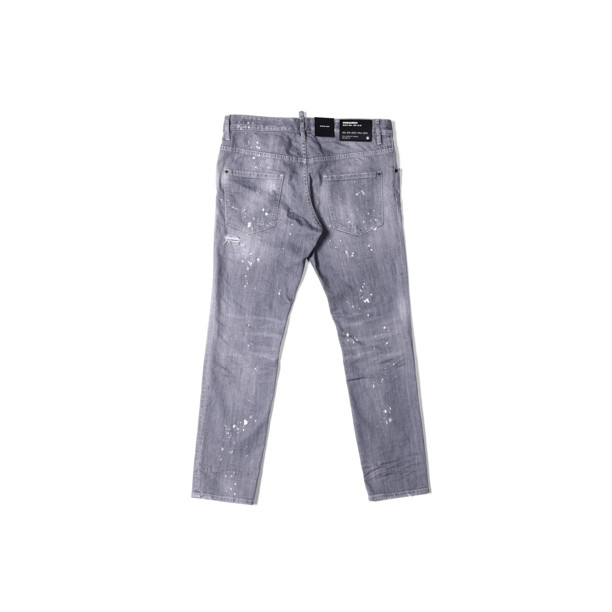 Back view of gray distressed jeans with white paint splatters and back pockets on white background