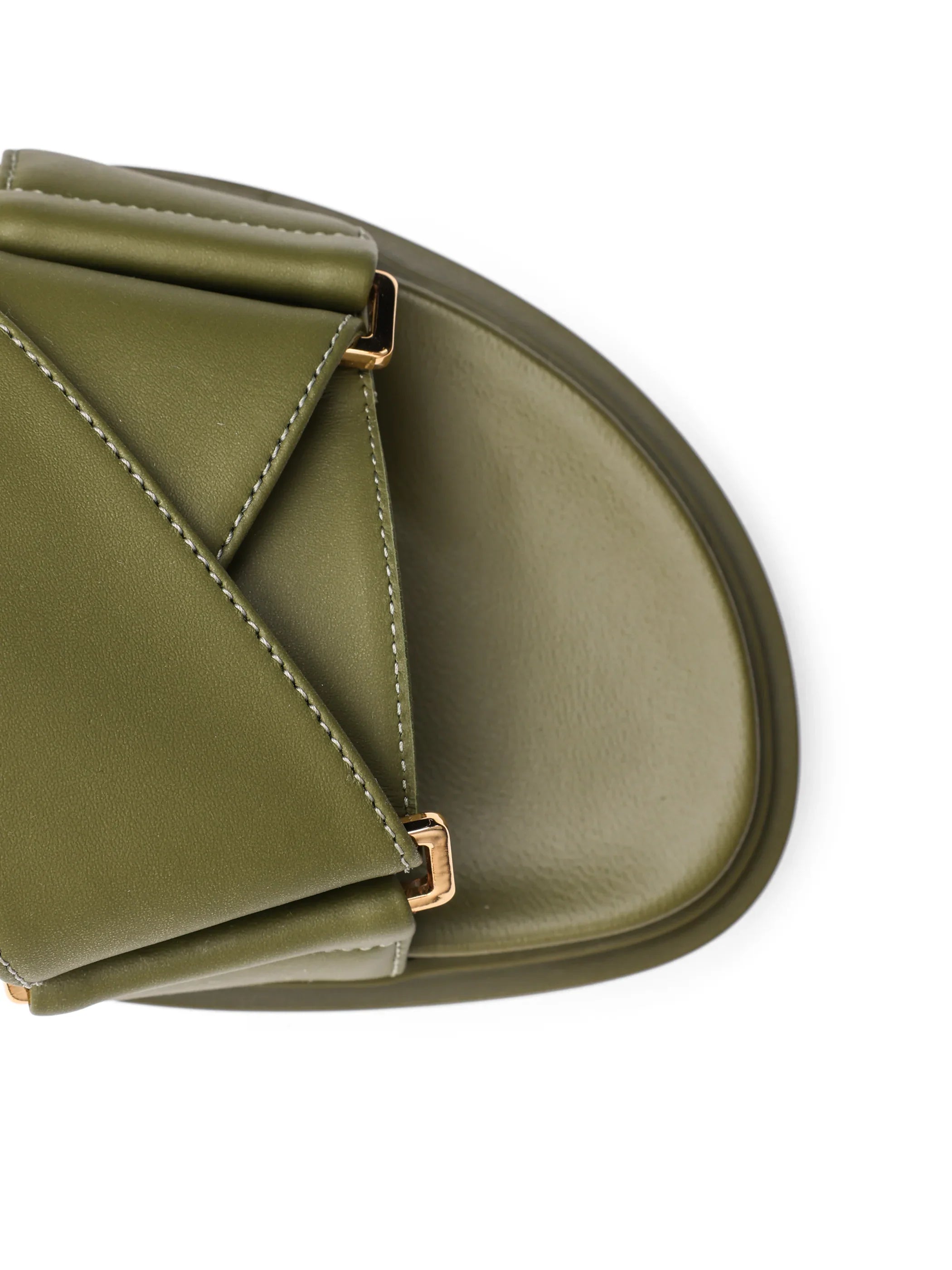 Close-up of olive green leather sandal with gold accent hardware and cushioned sole