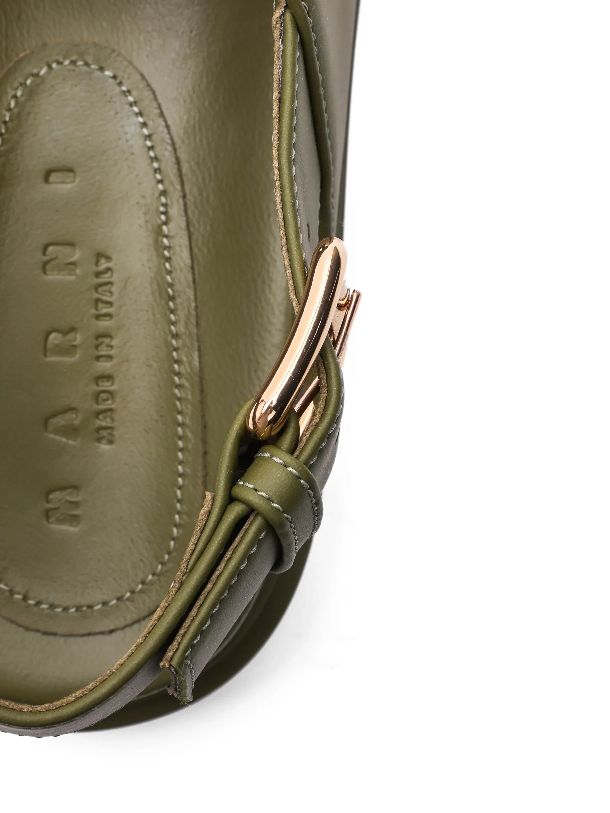 Close-up of olive green MARNI leather shoe with gold buckle and stitching detail