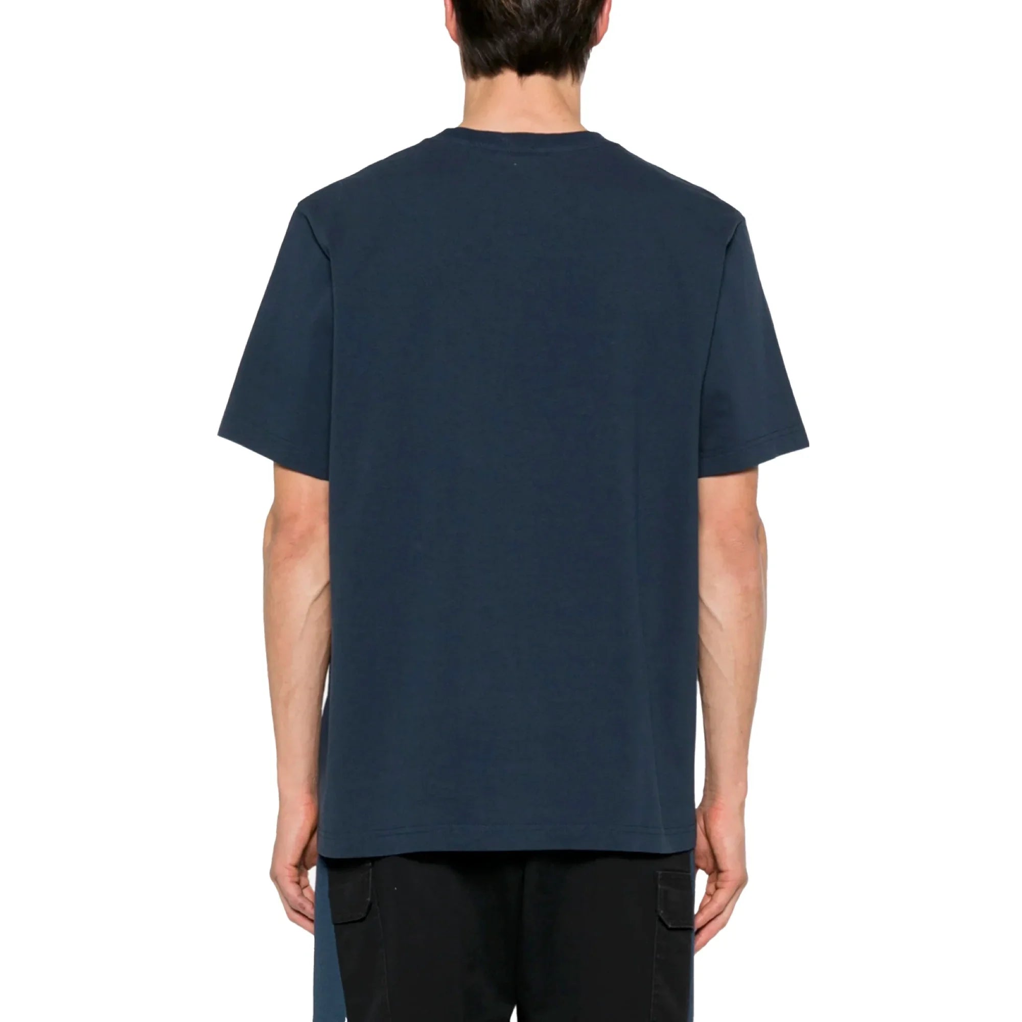 Back view of person wearing plain dark navy blue short sleeve t-shirt and black pants