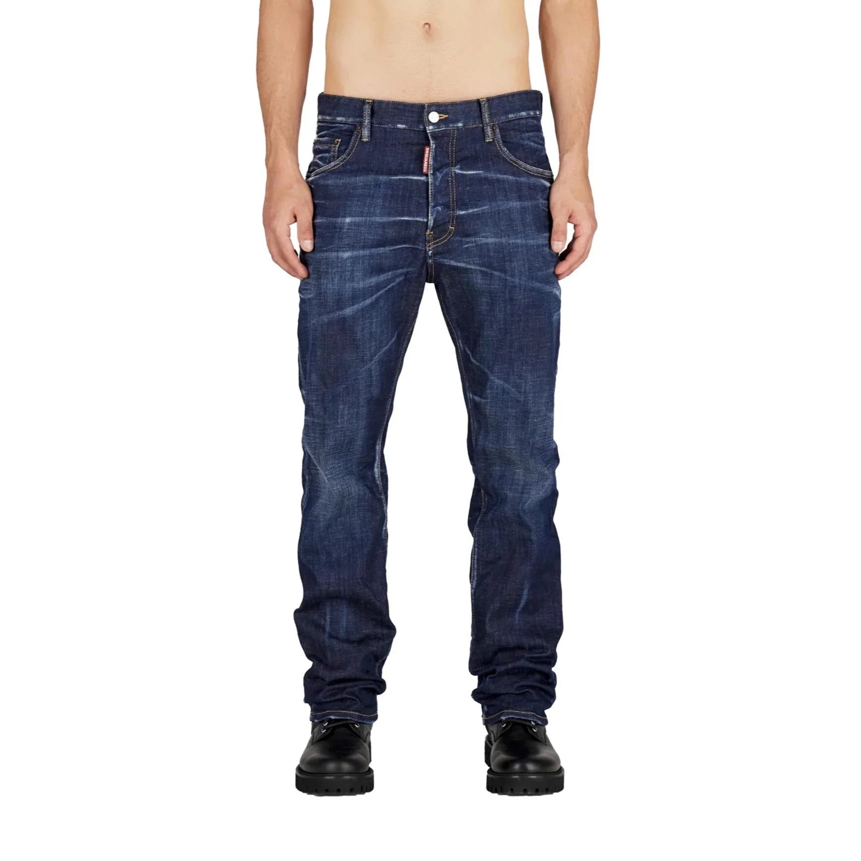 A person wearing DSQUARED2 blue navy five-pocket denim jeans with a buttoned waistband and twin-needle stitching, paired with black shoes.