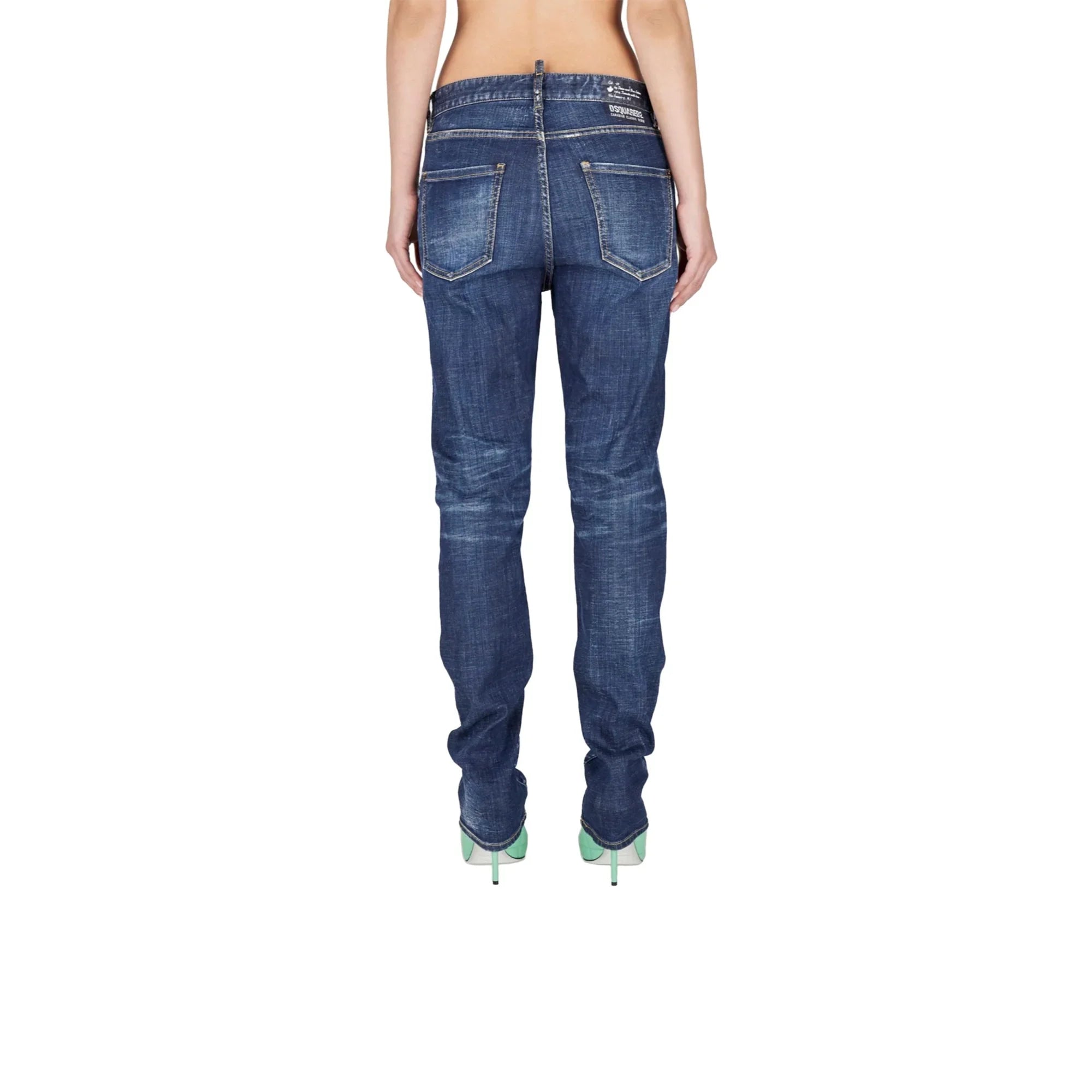 Rear view of woman wearing blue denim jeans with faded detailing and mint green high heels
