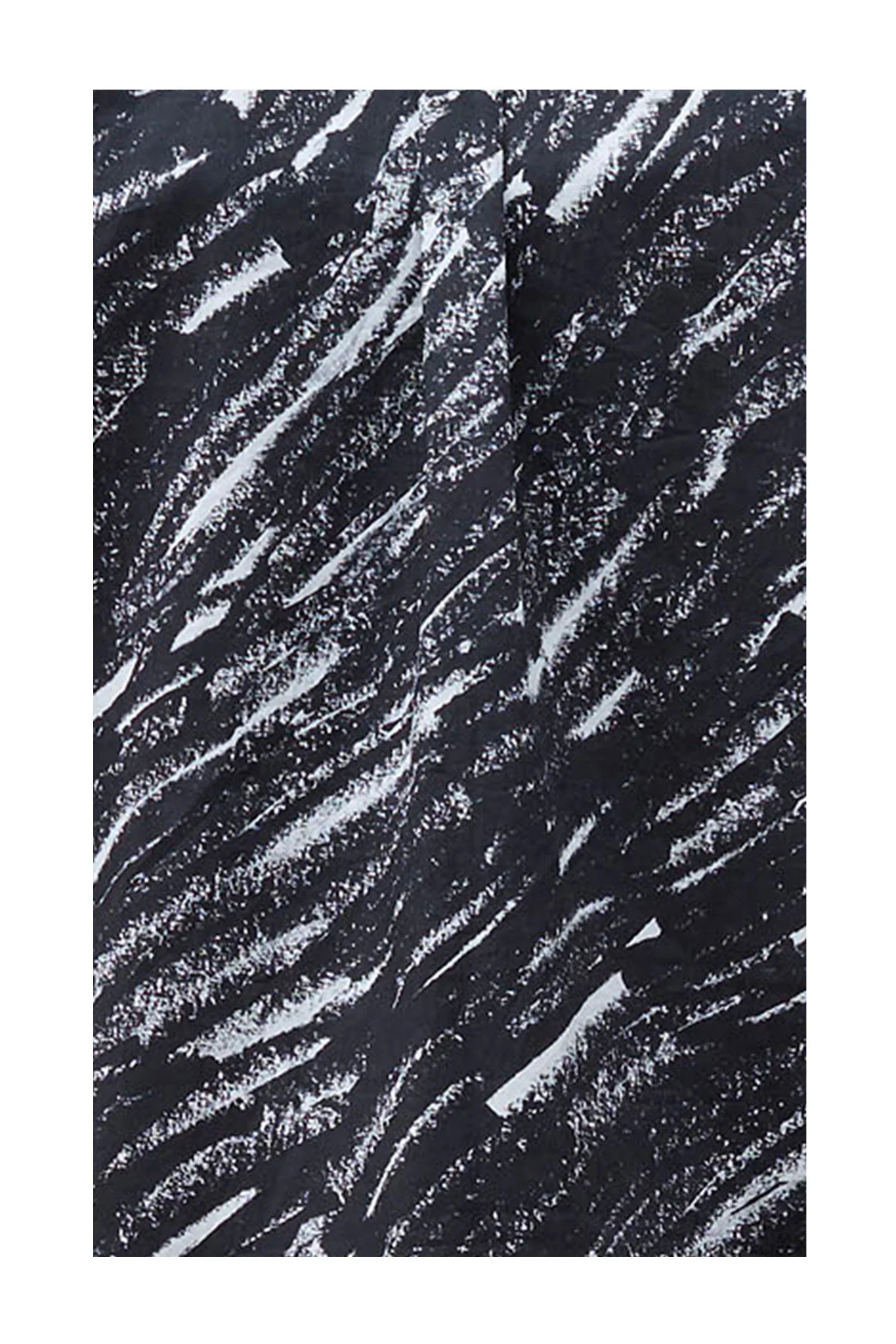 Close-up of black fabric with white abstract brushstroke pattern texture