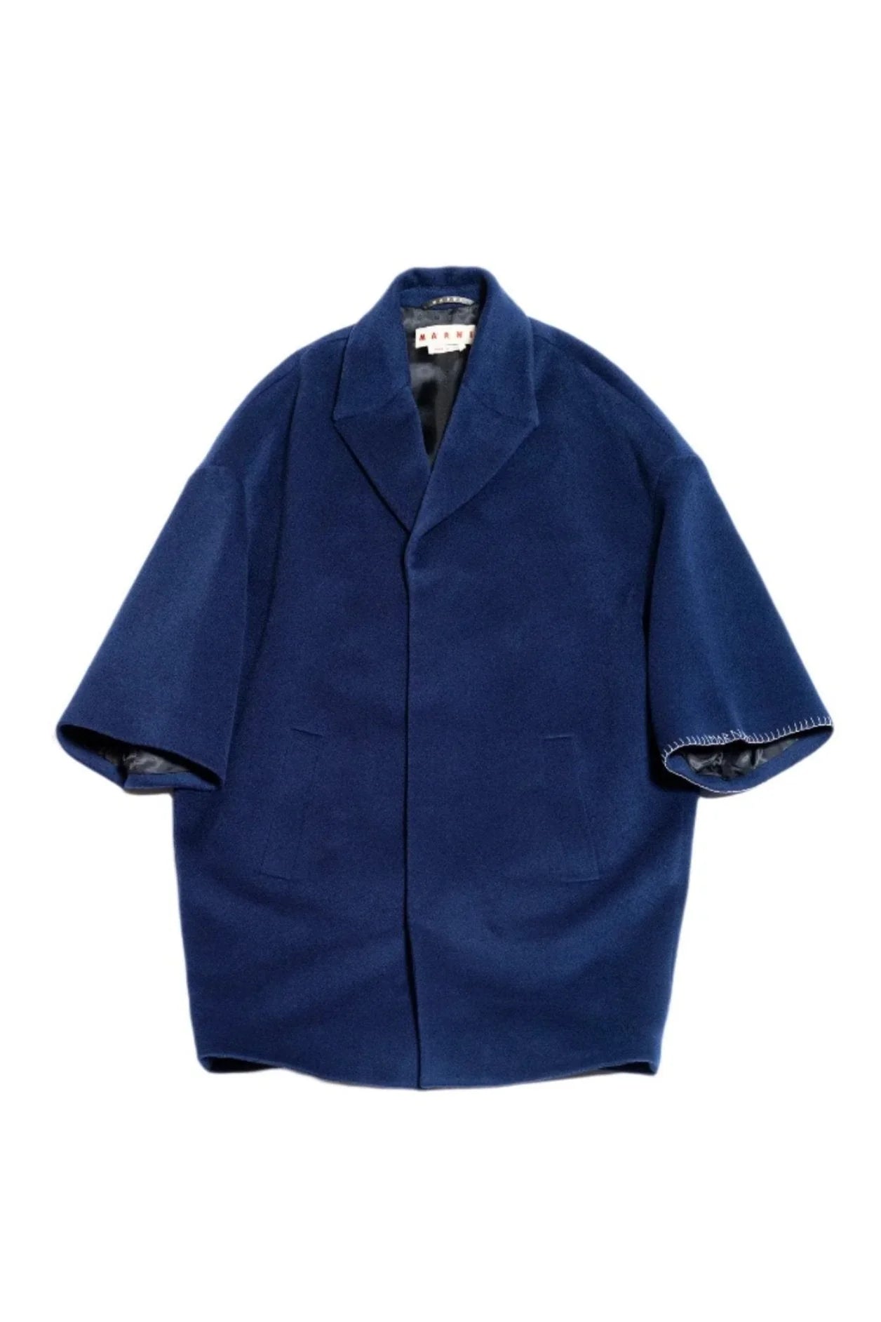 Navy blue oversized wool coat with wide sleeves and notched lapel collar