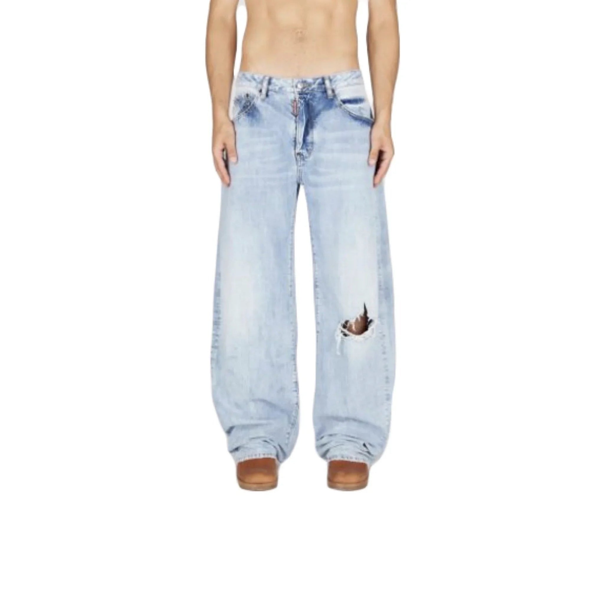 Male model wearing light blue distressed wide-leg jeans with a ripped hole on knee