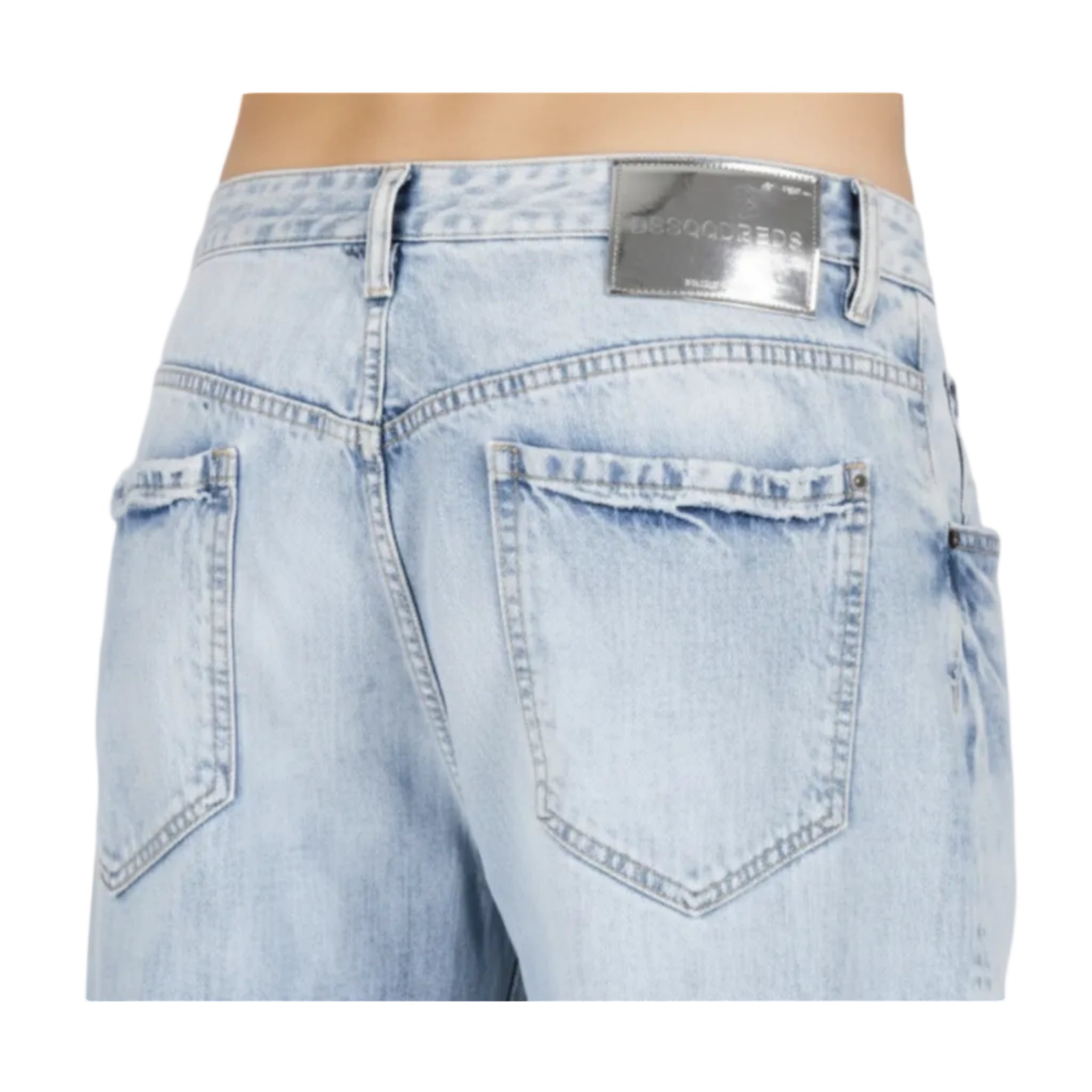 Light blue faded denim jeans with oversized back pockets and a leather brand patch on the waistband