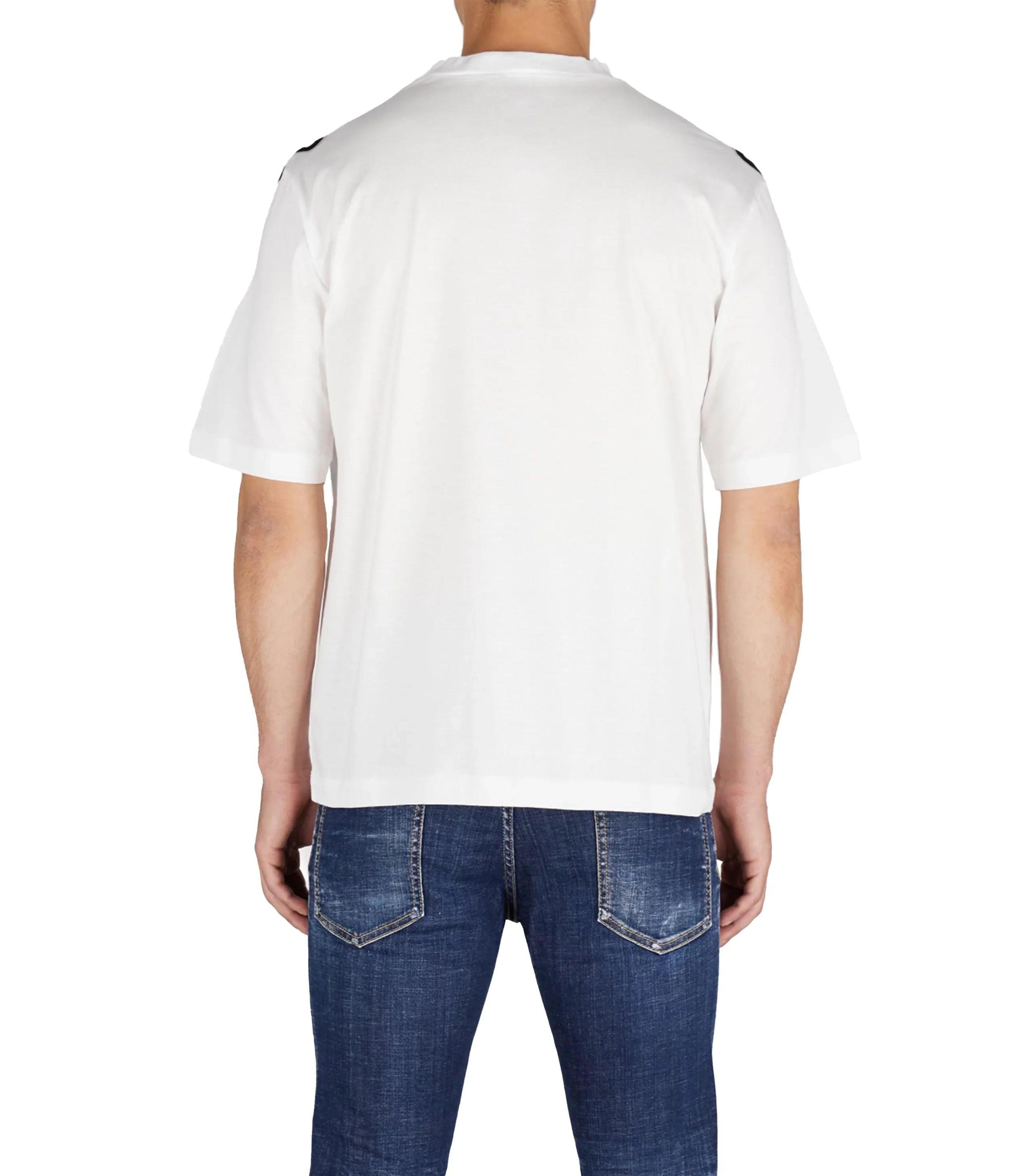 Back view of man wearing loose fit white t-shirt and blue denim jeans with faded pockets