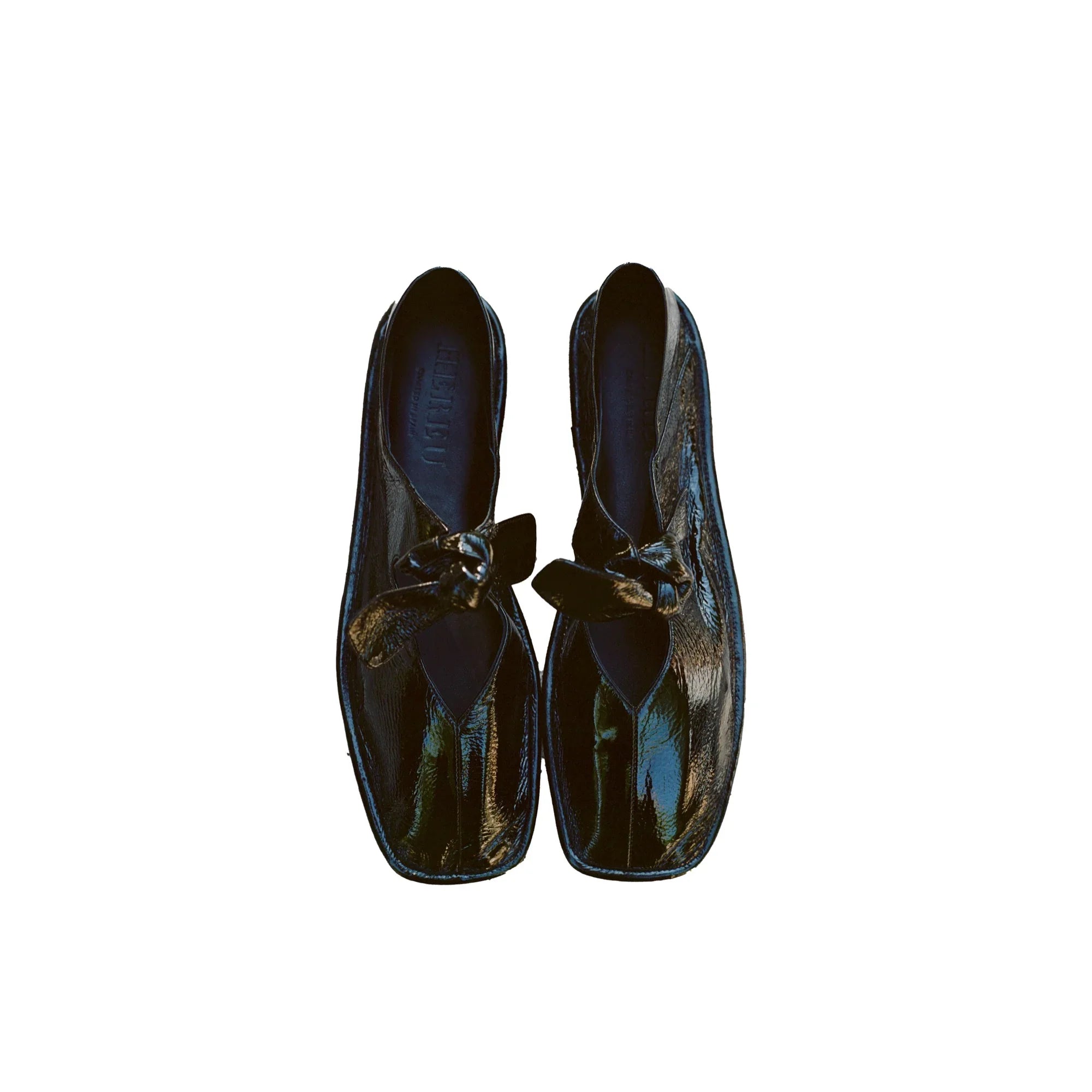 Pair of glossy black crinkled leather slip-on shoes with squared toes and knot detail