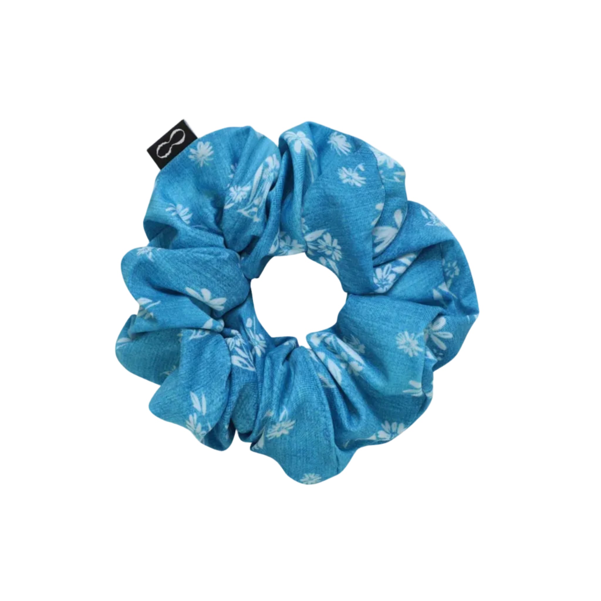 Blue scrunchie with floral pattern on a beige background