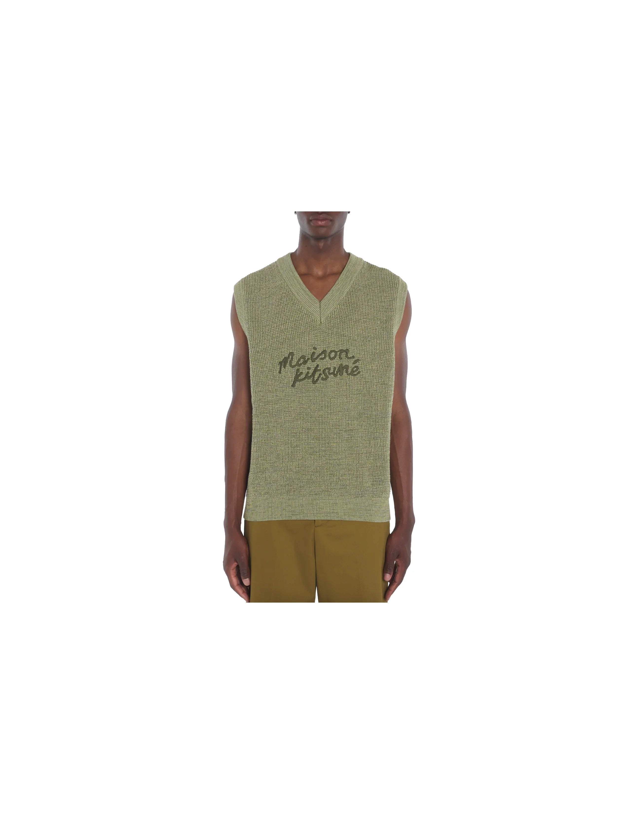 Model wearing green Maison Kitsuné knitted sleeveless vest with handwriting logo, paired with olive pants