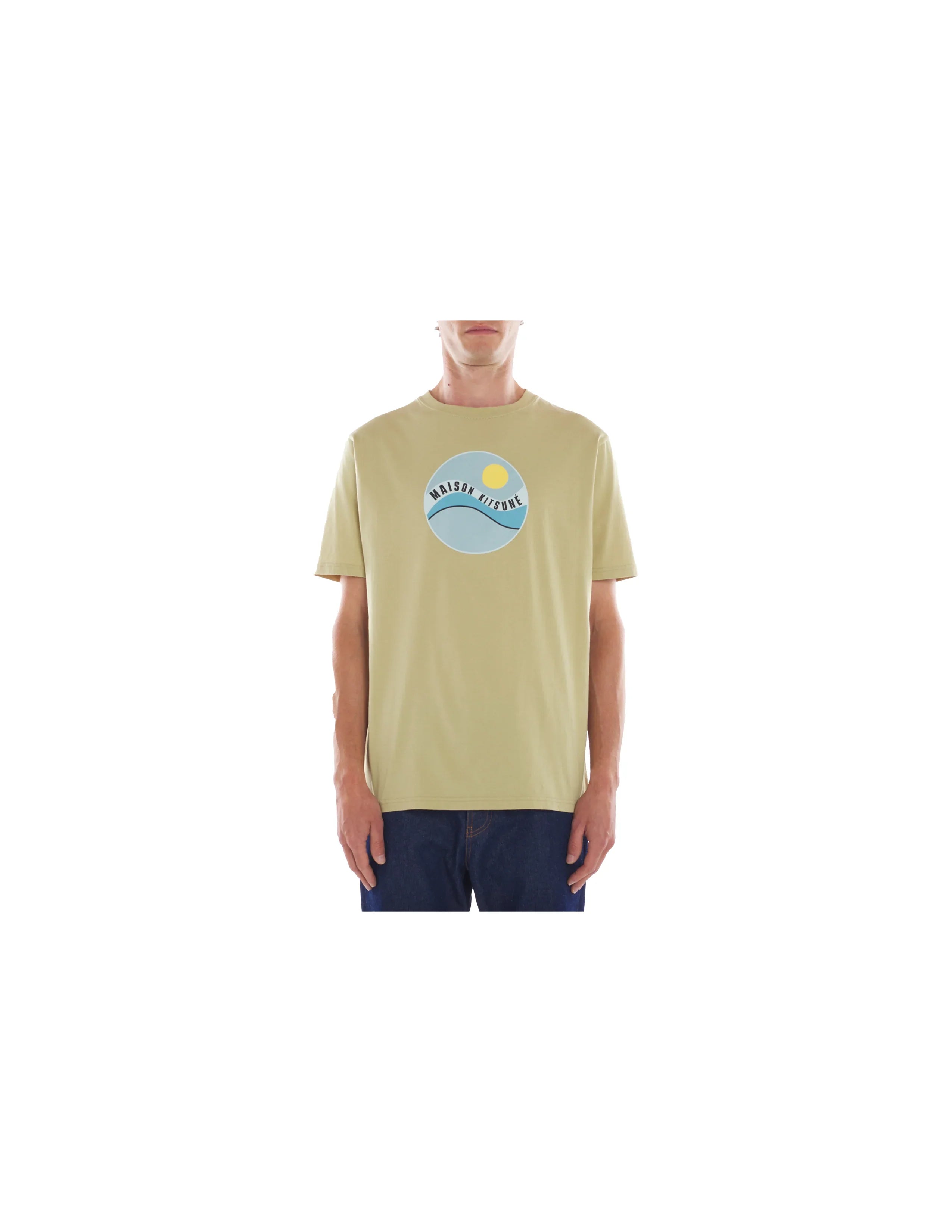 Man wearing beige Maison Kitsuné Pop Wave graphic t-shirt and blue jeans