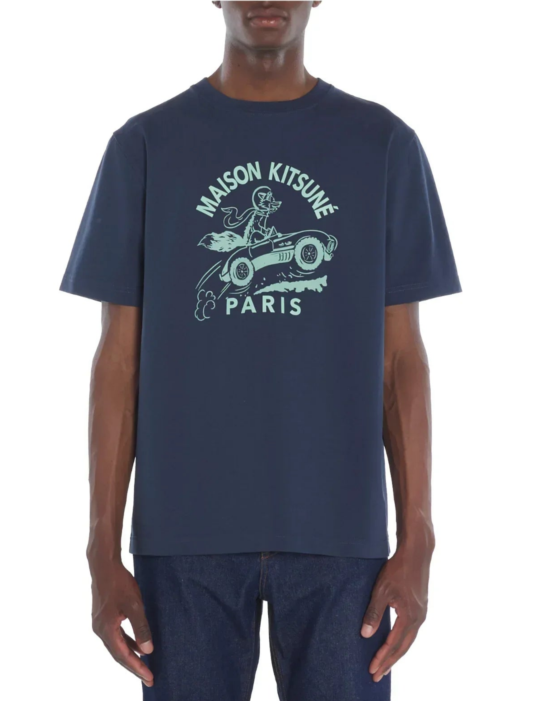 Man wearing navy Maison Kitsuné Paris Racing Fox graphic tee and dark jeans