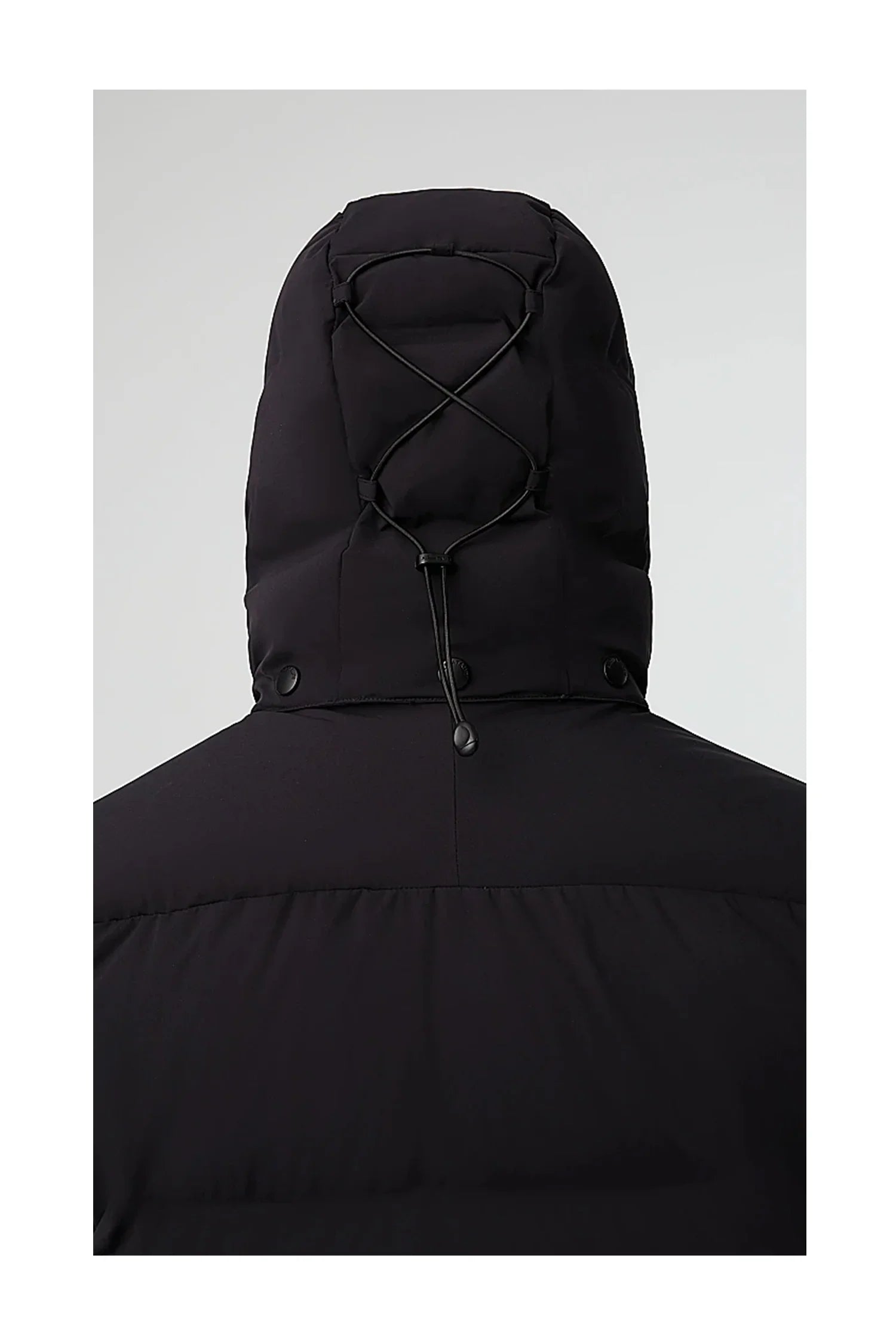 Back view of black puffer jacket with adjustable hood and toggle drawstrings