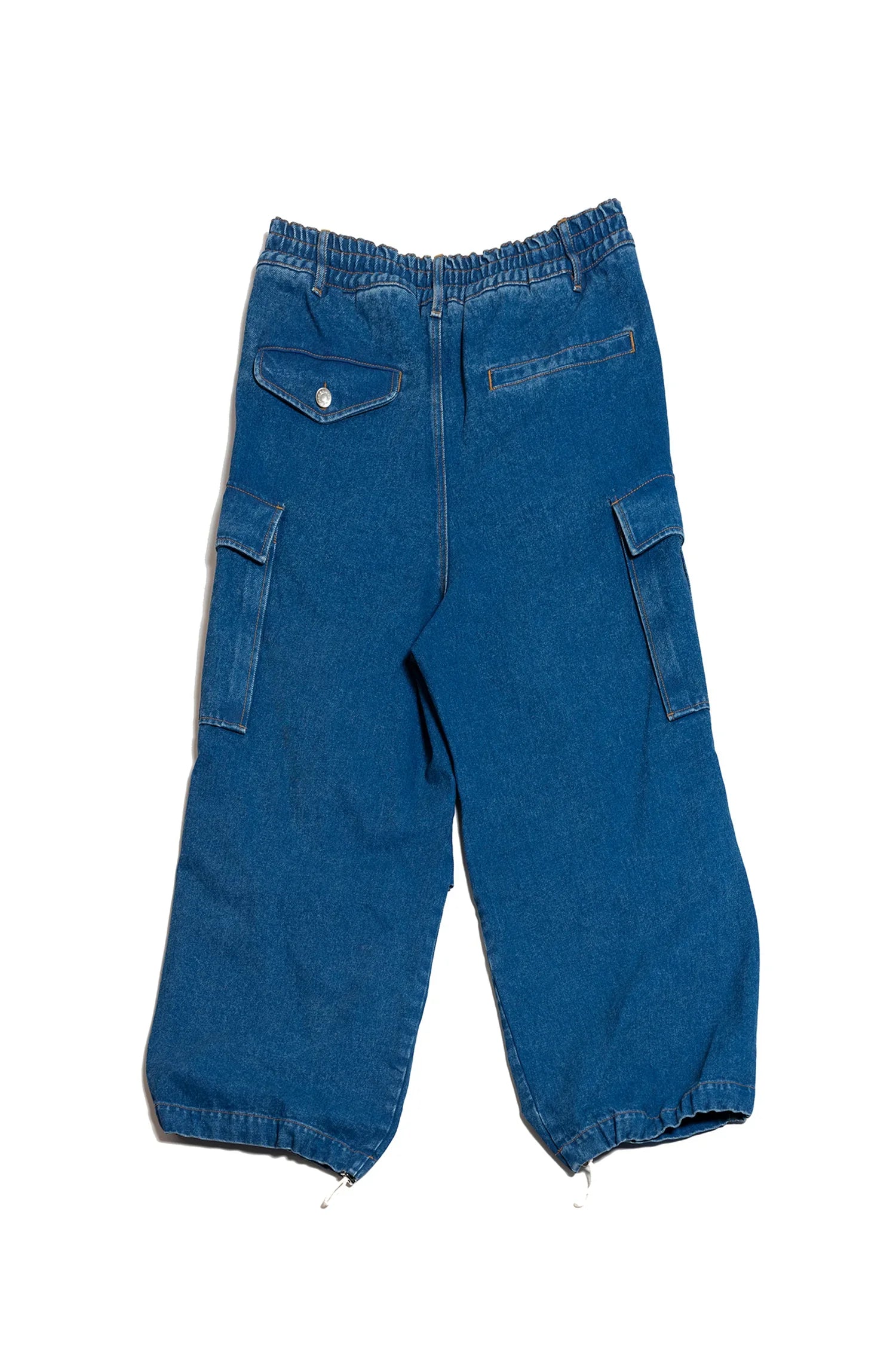 Blue denim cargo pants with elastic waist and ankle drawstrings, multiple pockets on white background