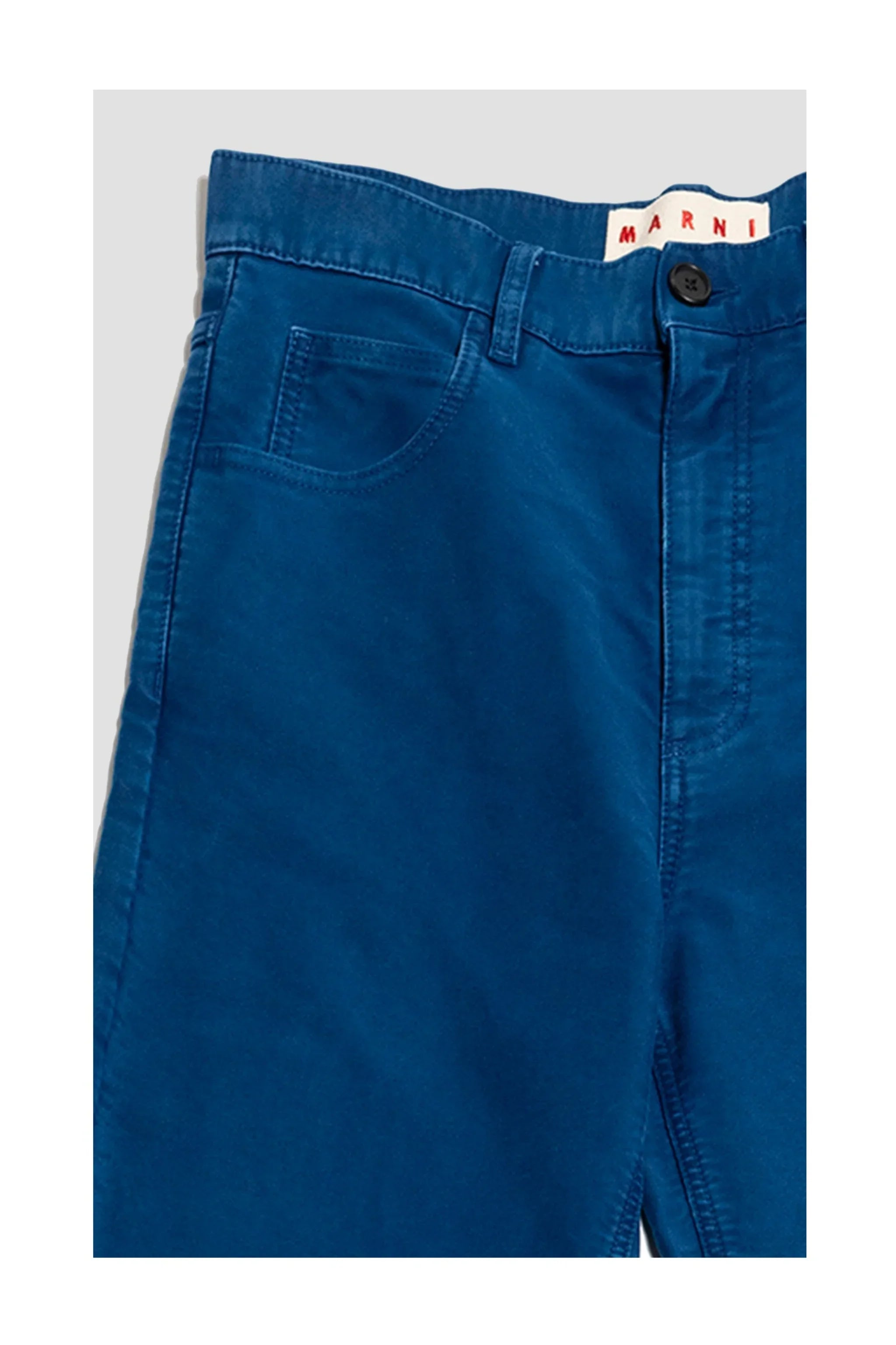 Close-up of blue Marni brand pants with front pocket and button closure