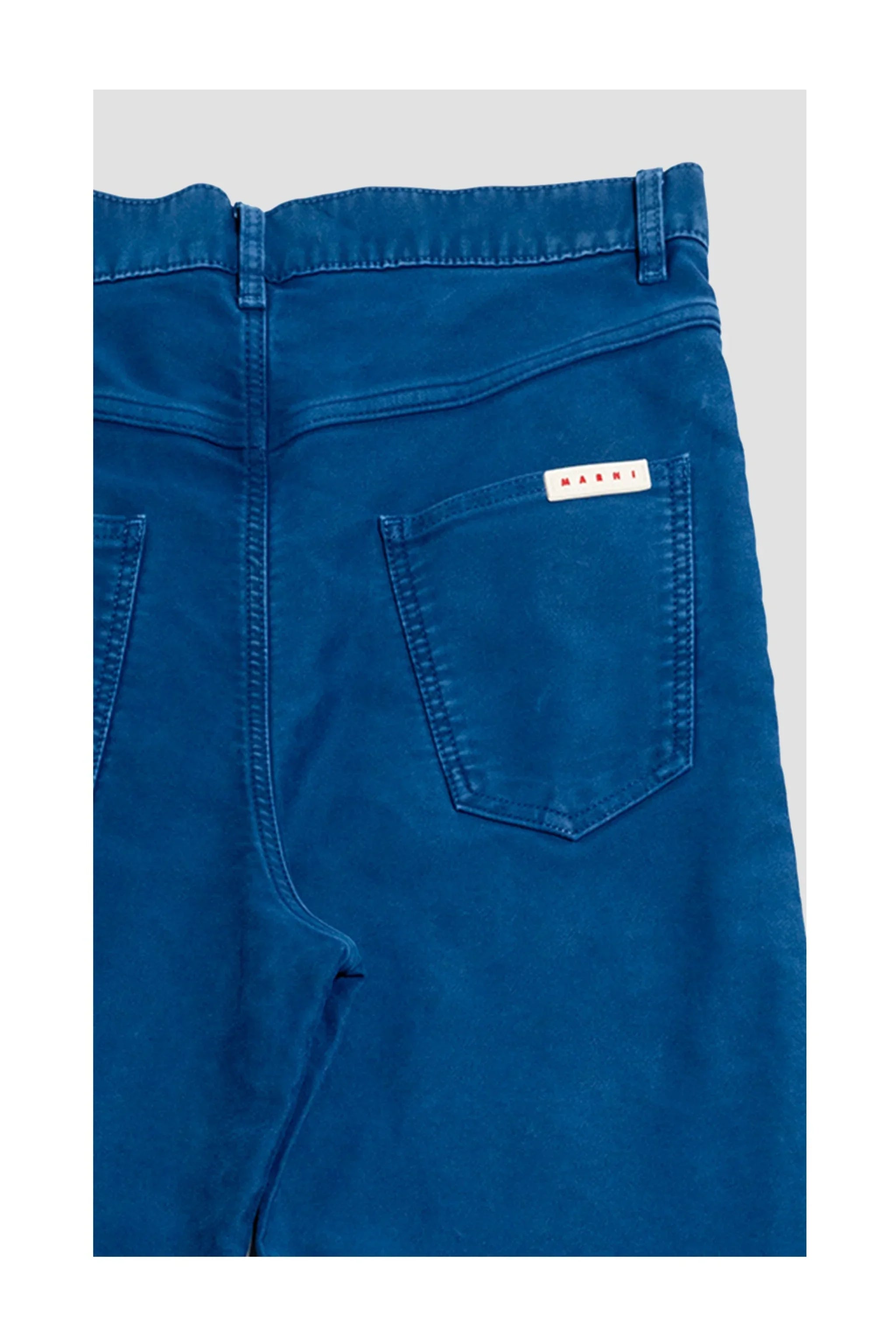 Back view of blue Marni jeans with visible stitched pockets and brand label on pocket
