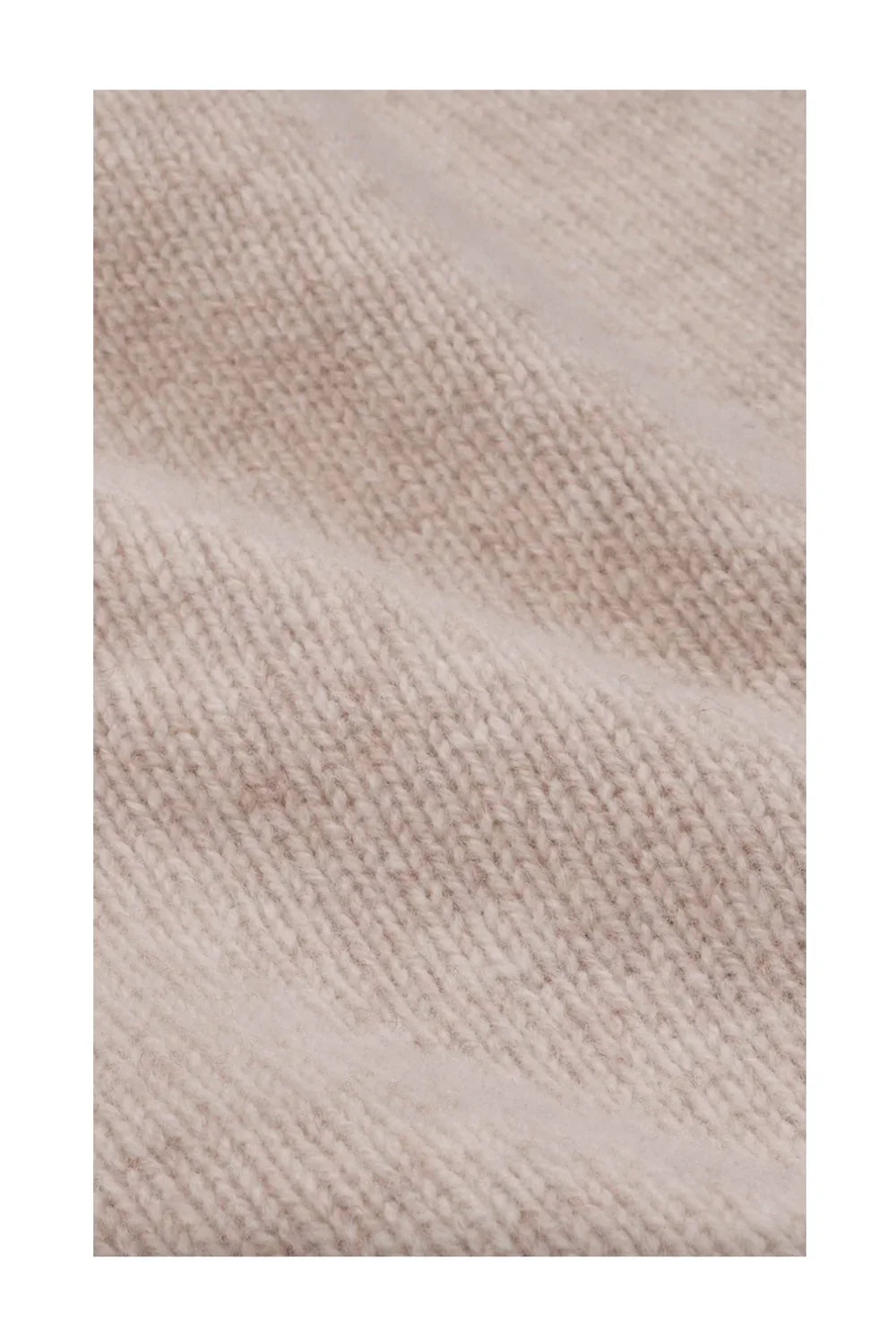 Close-up of beige cashmere fabric knit texture for luxury pants