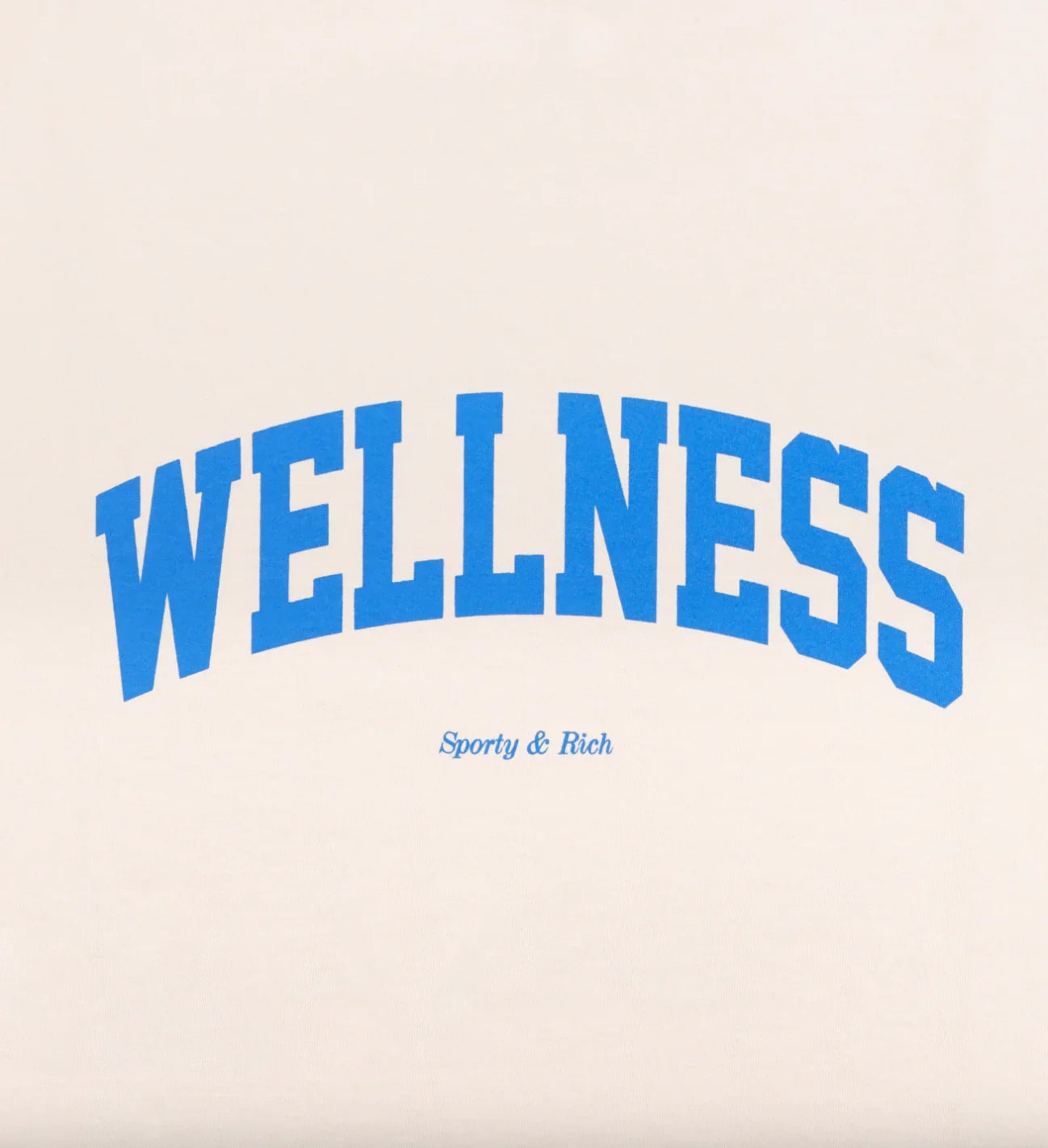 Beige fabric with blue block letters spelling WELLNESS and smaller text Sporty & Rich