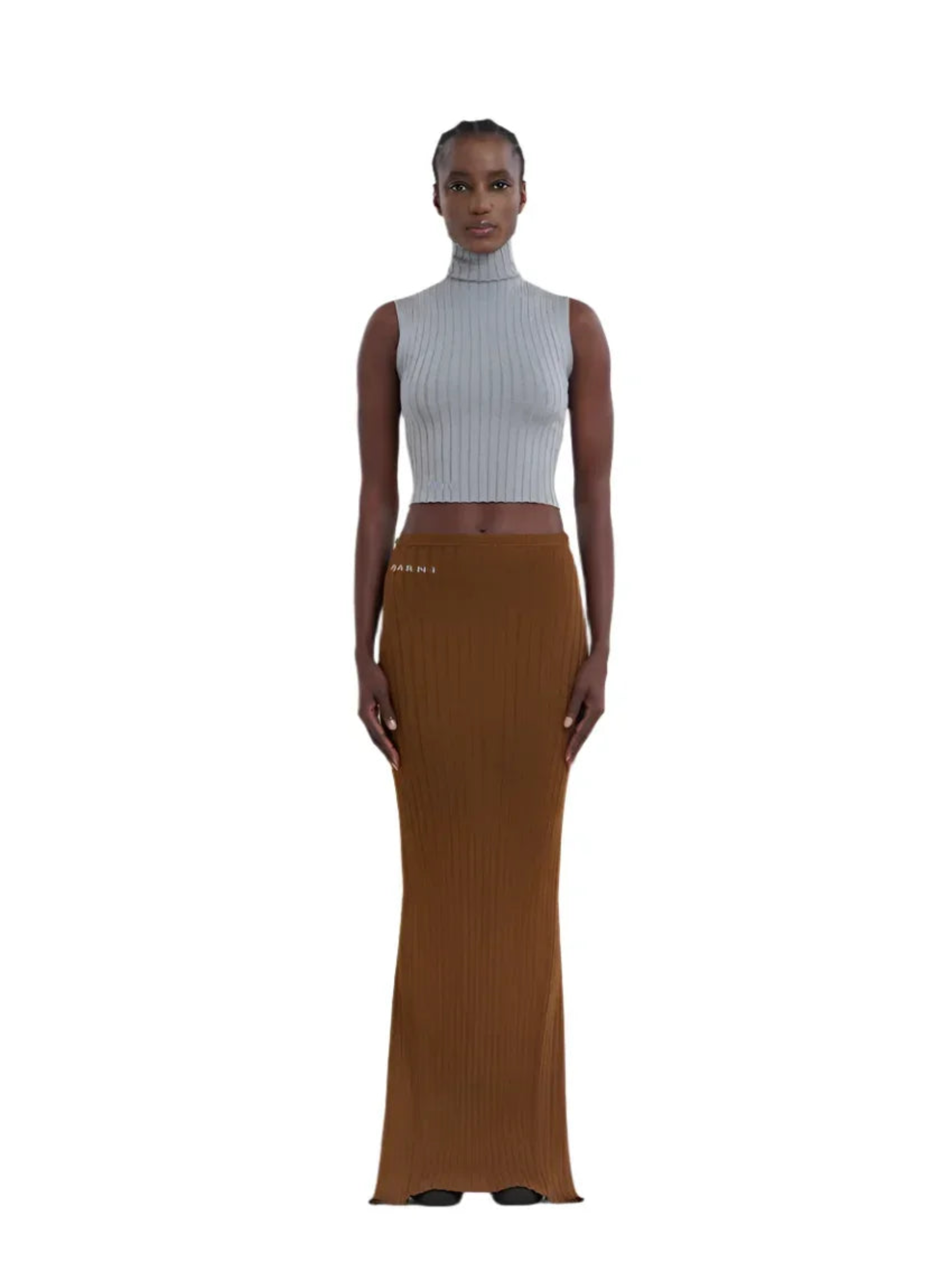 Model wearing sleeveless gray ribbed turtleneck crop top and long brown ribbed skirt with logo detail