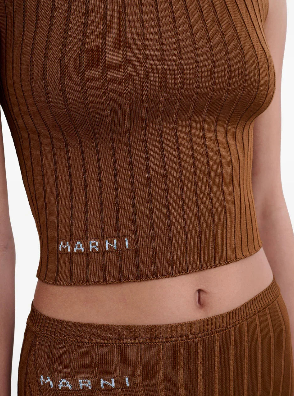 Close-up of brown ribbed knit Marni crop top and matching pants with white logo on fabric