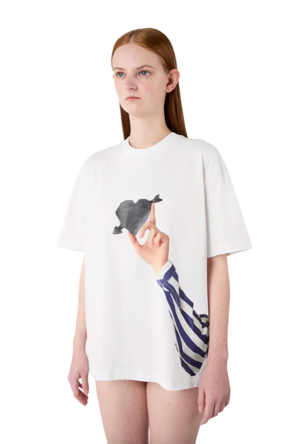 Model wearing white oversized t-shirt featuring black heart graphic and striped sleeve print on the front