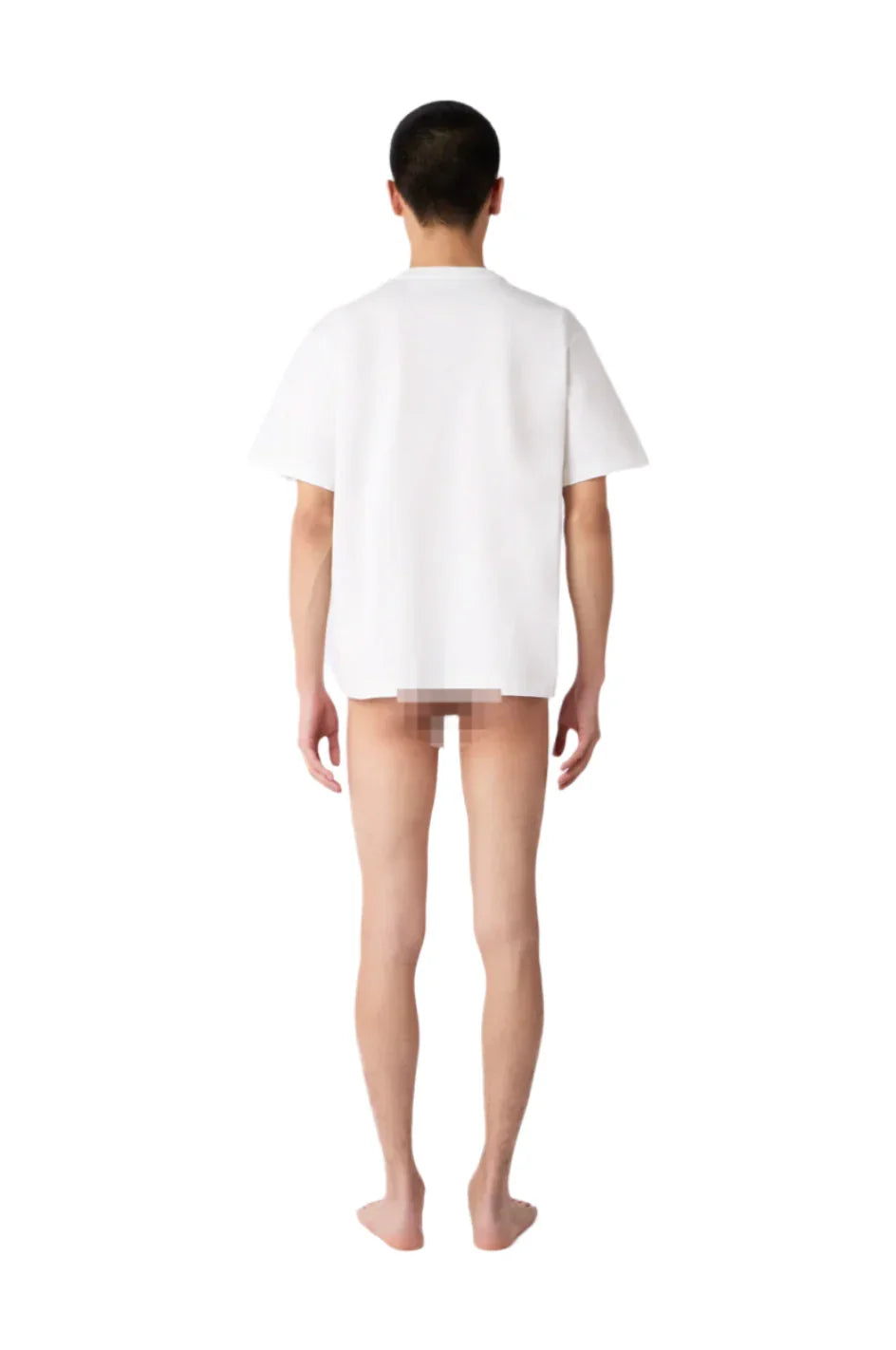 Back view of a male model wearing a plain white oversized T-shirt against white background