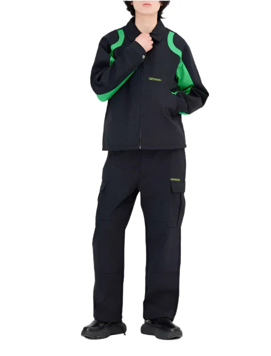 Model wearing black and green Moncler jacket and black cargo pants with logo, styled with black shoes