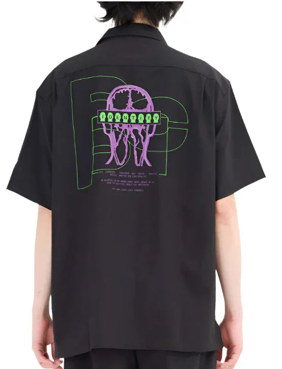 Black short-sleeve shirt with purple jellyfish and green outlined text reading IDENTITY on the back