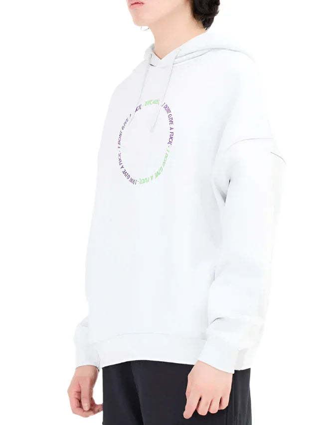White hoodie with circular green and purple text design worn by person with black hair and black pants