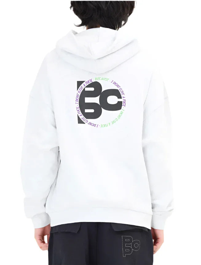White hoodie with black and colorful circular graphic and text on back, paired with black pants featuring matching logo