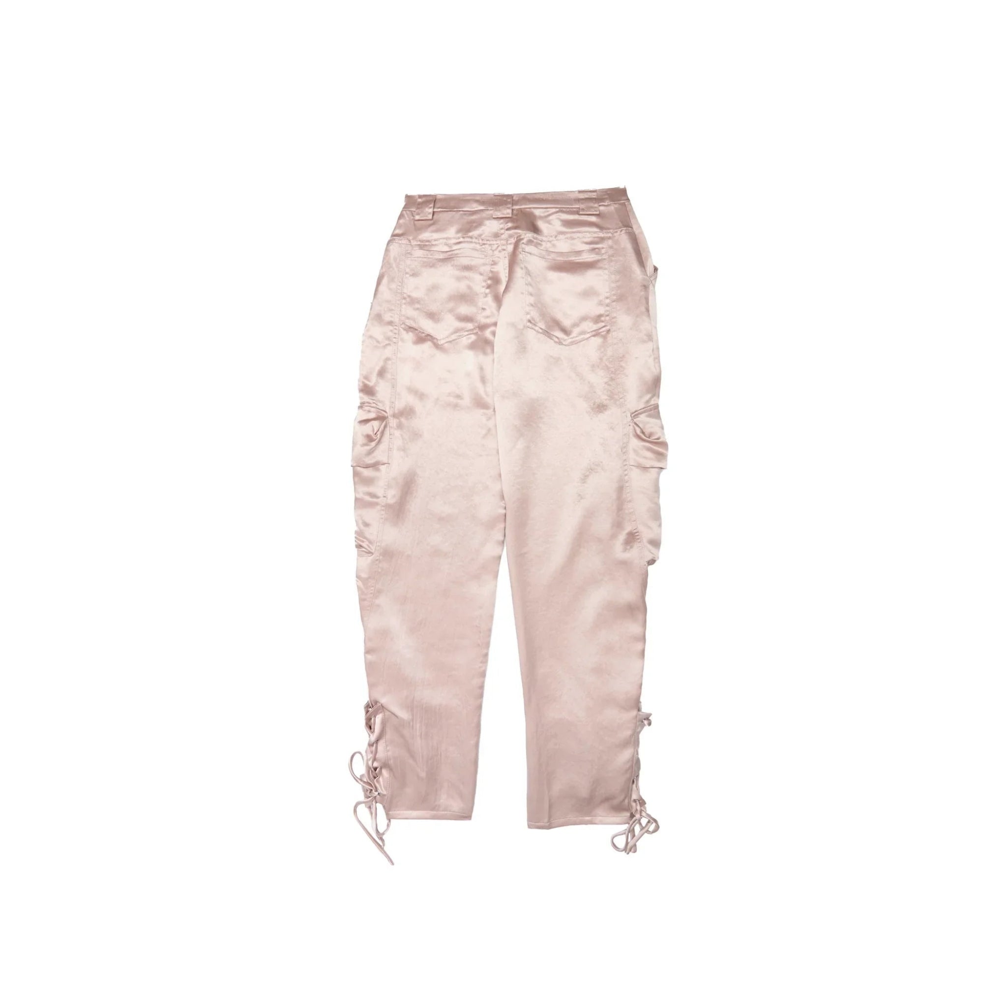 Back view of light pink satin cargo pants with side pockets and lace-up details on white background