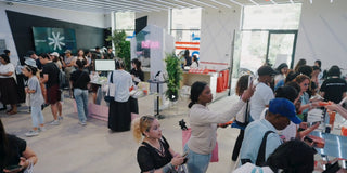 People shopping in a store with various products and displays.