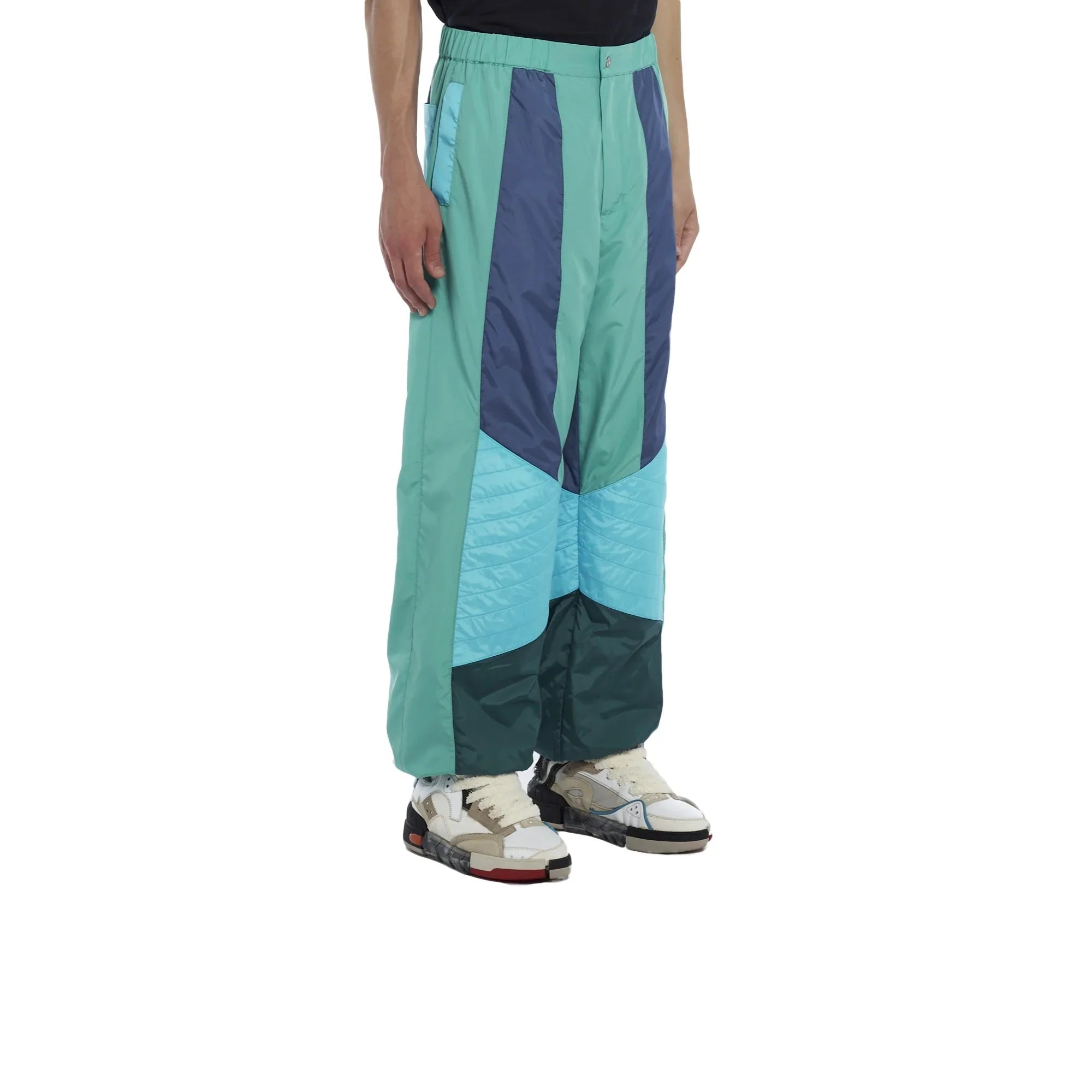Men's colorblock nylon insulated pants in turquoise, navy, and teal with side pockets