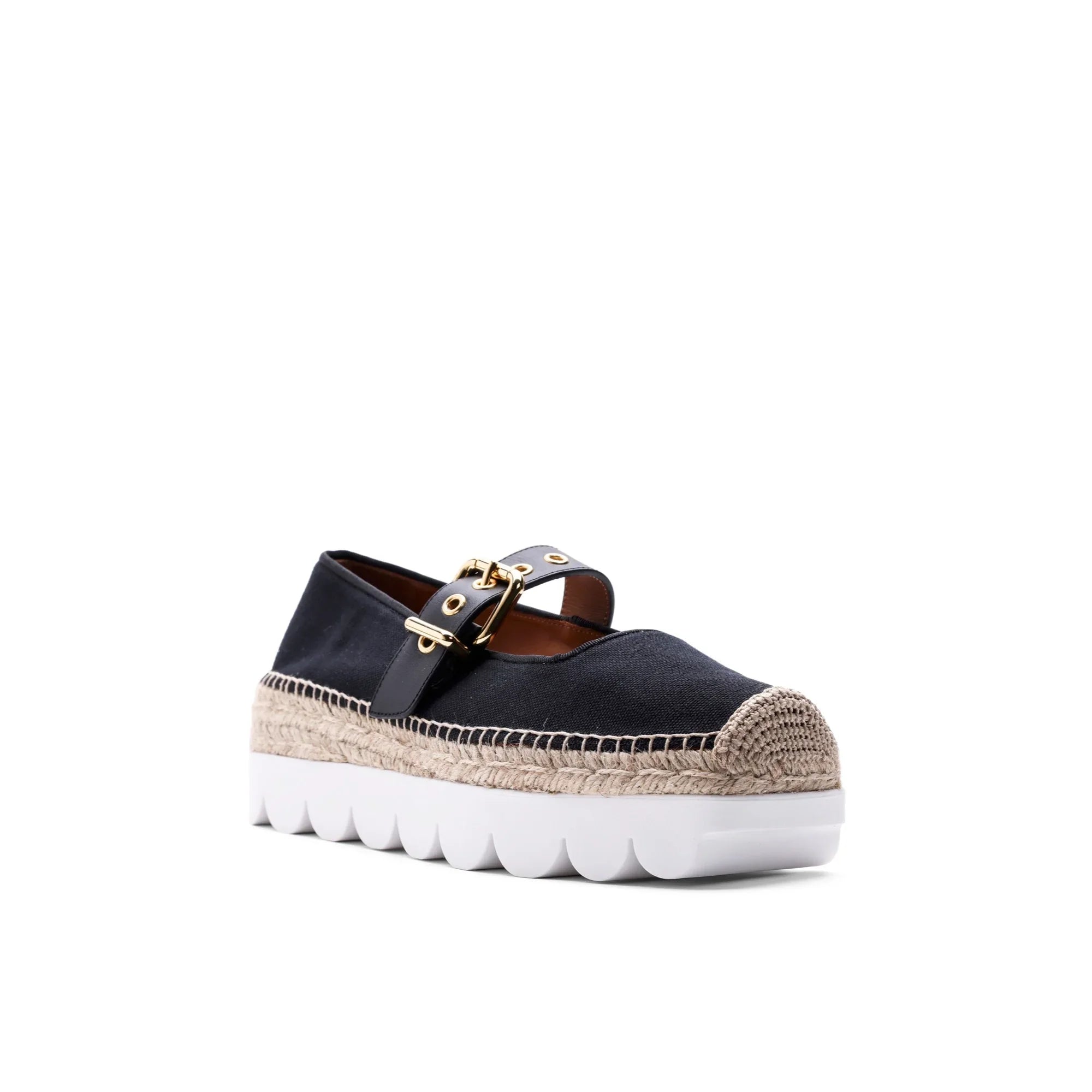 Black espadrille shoe with beige woven toe cap, jute midsole, gold buckle strap, and white rubber platform sole