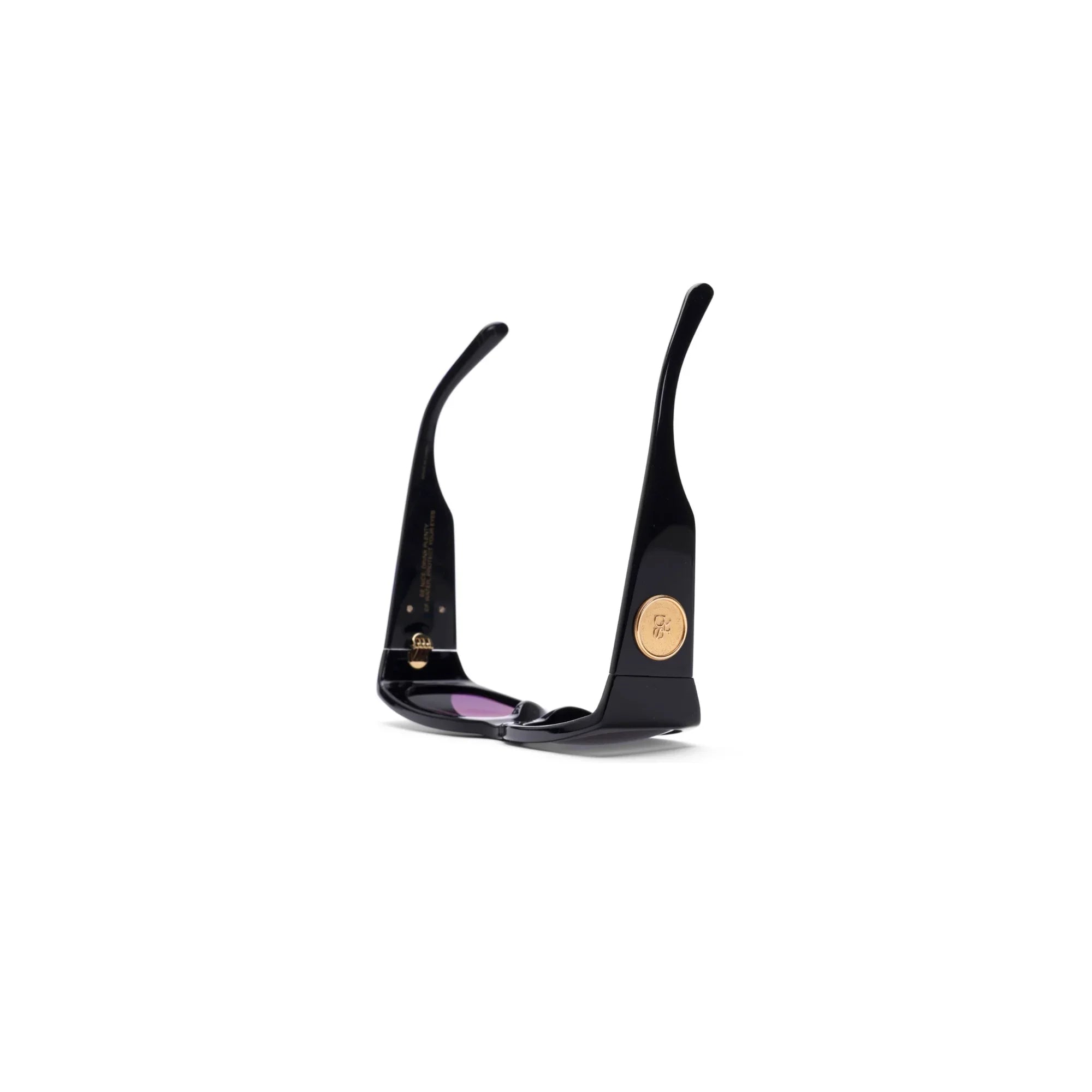 Black stylish sunglasses with purple lenses and gold logo accents on the temples
